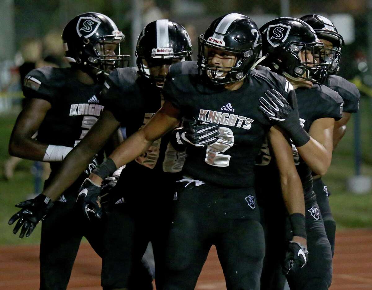 Steele’s Caden Sterns (center) celebrates with teammates after a scoring a touchdown on an interception return during second half action against Judson on Sept. 23, 2016 at Lehnhoff Stadium.