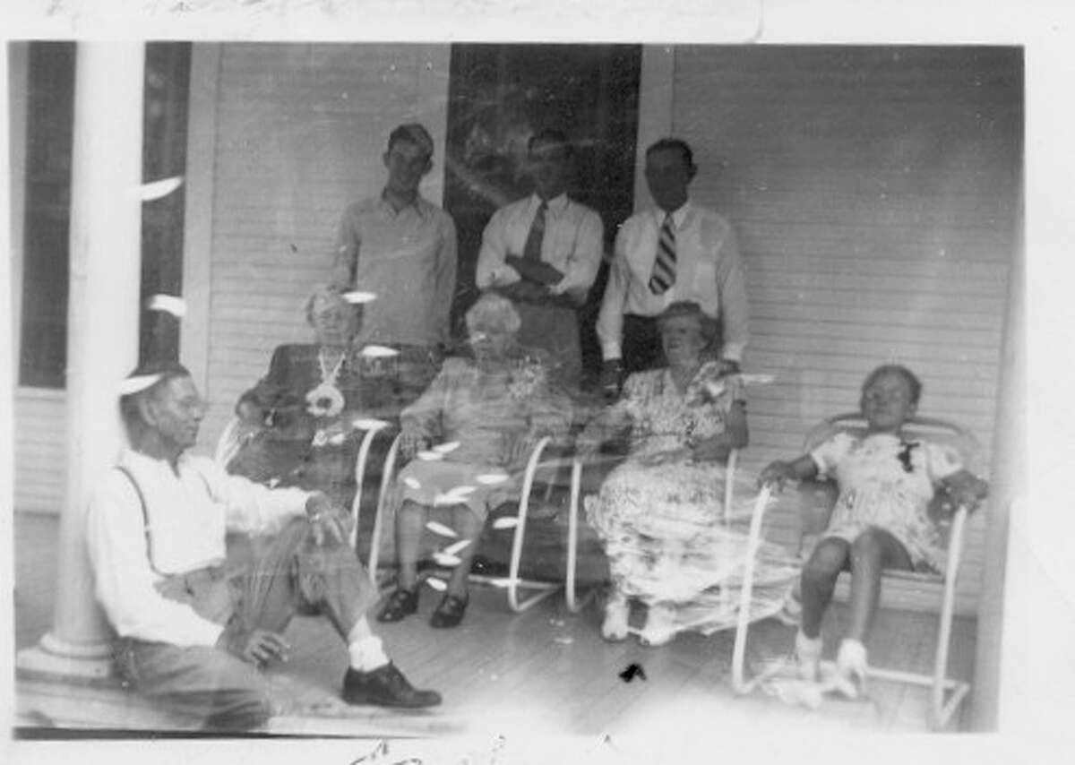 The Cochran family on the front porch of the Laura Grogan Cochran home.