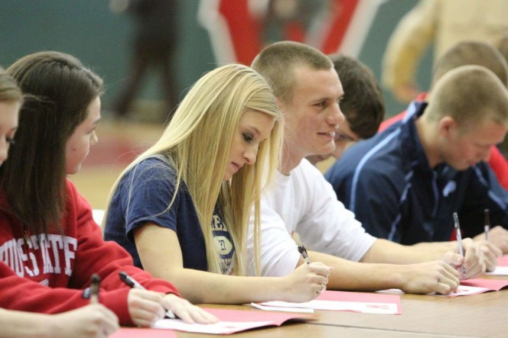 Athletes sign letters of intent to chosen colleges