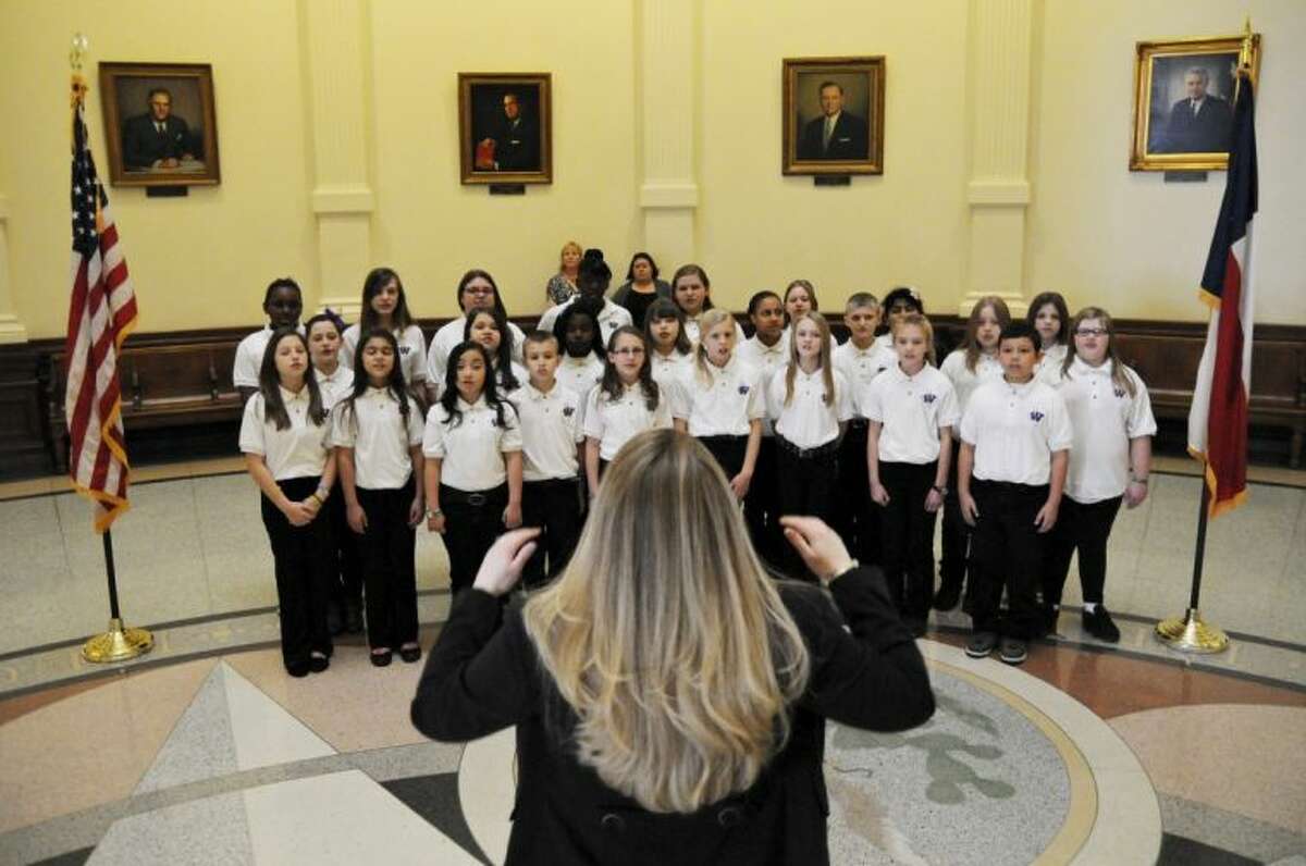 The Willis ISD Parmley Performers school choir performs in the Rotunda of the state Capitol in Austin Thursday. Six students from the district were honored on the House floor for their success in the Student Spaceflight Experiments Program.