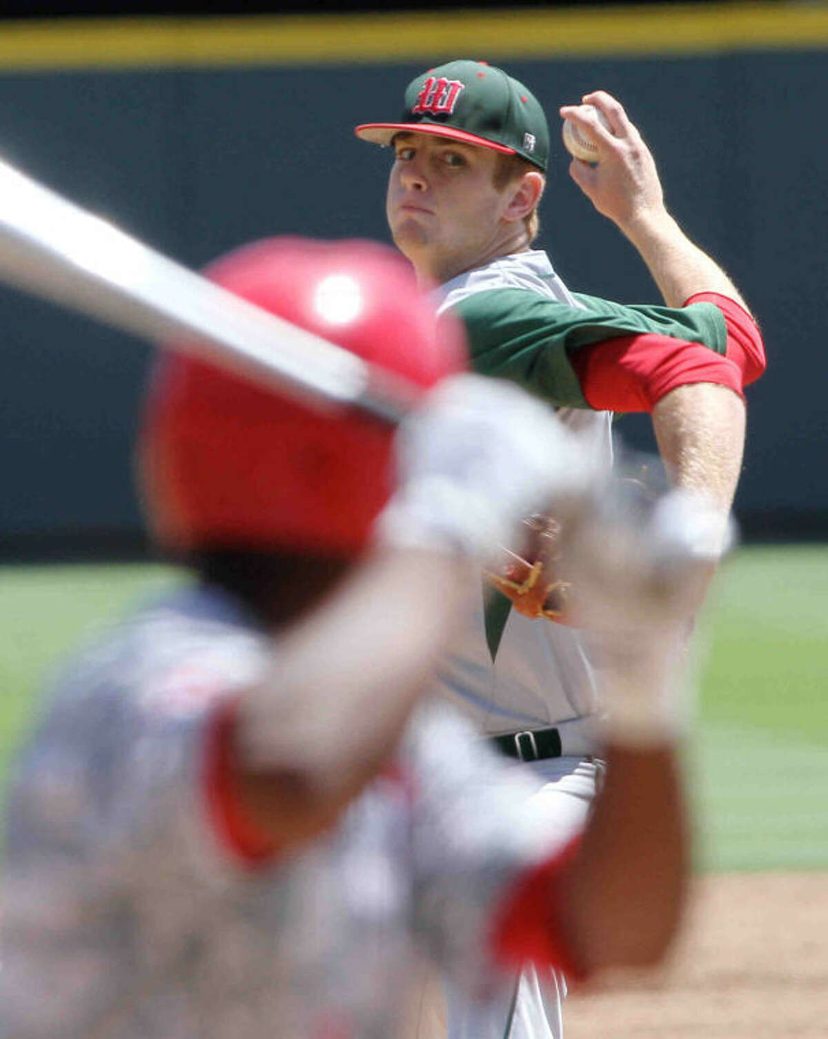 The Woodlands pitcher Carter Hope (23) throws in the first inning of the Class 5A UIL state baseball championship game on Saturday, June 8, 2013, at Dell Diamond in Round Rock, Texas. The Woodlands defeated Fort Bend Dulles 9-5. Go to HCNPics.com to view and purchase this photo, and others like it.