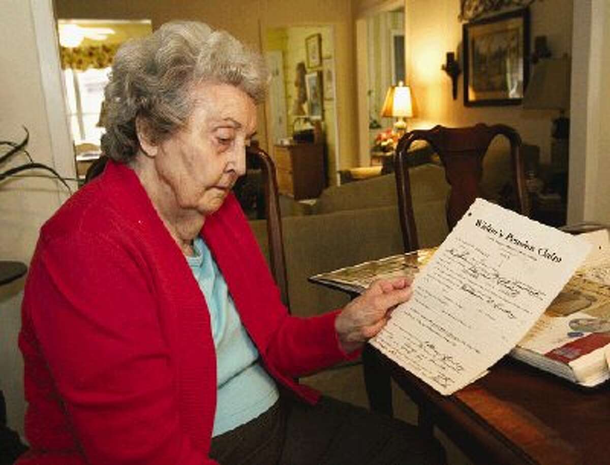 Floye Goodspeed looks over the official application for a Civil War pension made by her father in 1929.