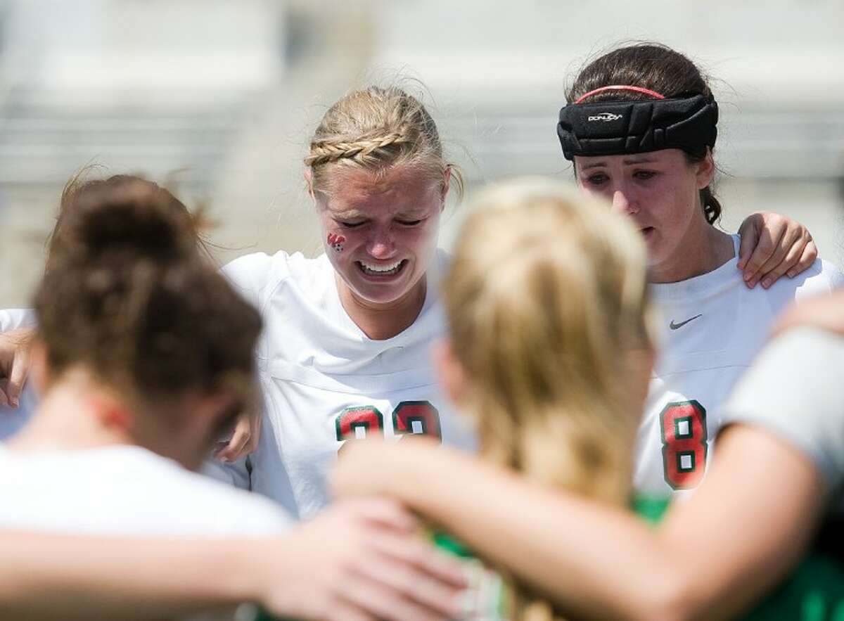 The Woodlands senior defenders Katie Kratkiewicz, left, and Claire Watson react after the Lady Highlanders’ 1-0 loss to McKinney Boyd on Saturday in the Region II-5A final at the Kelly Reeves Athletic Complex in Austin.