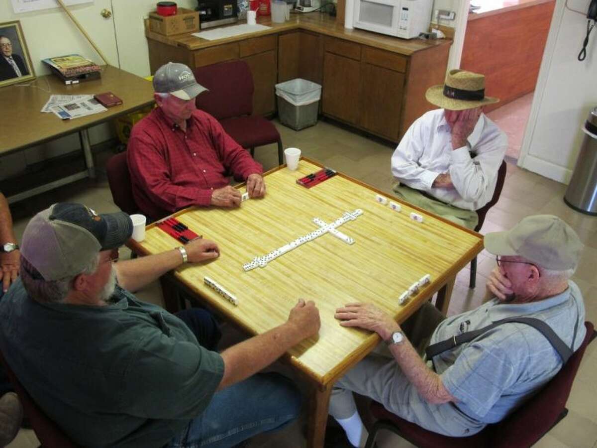 Farmers play dominos inside the Lyford Gin Association. Farmers are at a loss as the Rio Grande Valley suffers through its driest stretch ever recorded.