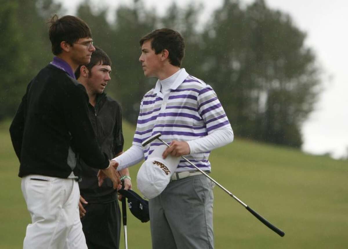 Montgomery’s Jesse Massengale shakes hands with fellow players after finishing the second round during the Region III-4A Tournament on Thursday at Raven Nest Golf Club in Huntsville. To view or purchase this photo and others like it, visit HCNpics.com.
