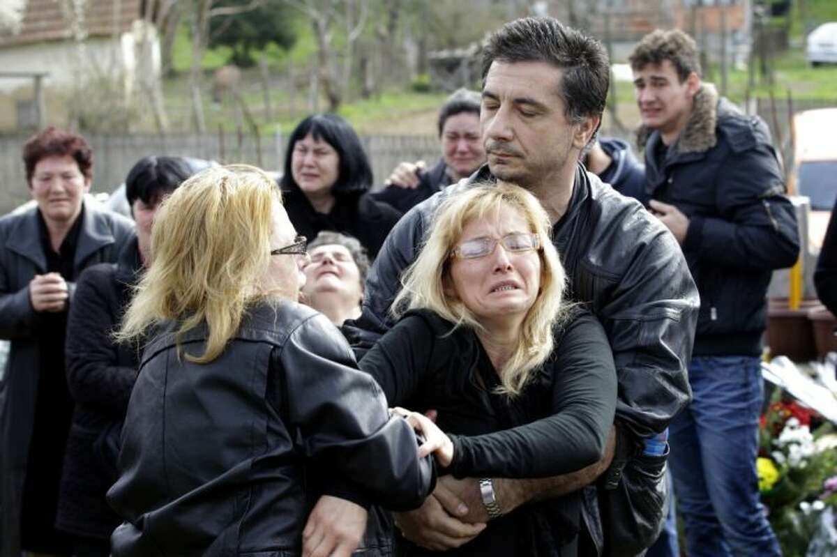 Tears flow as 13 Serbian shooting victims buried