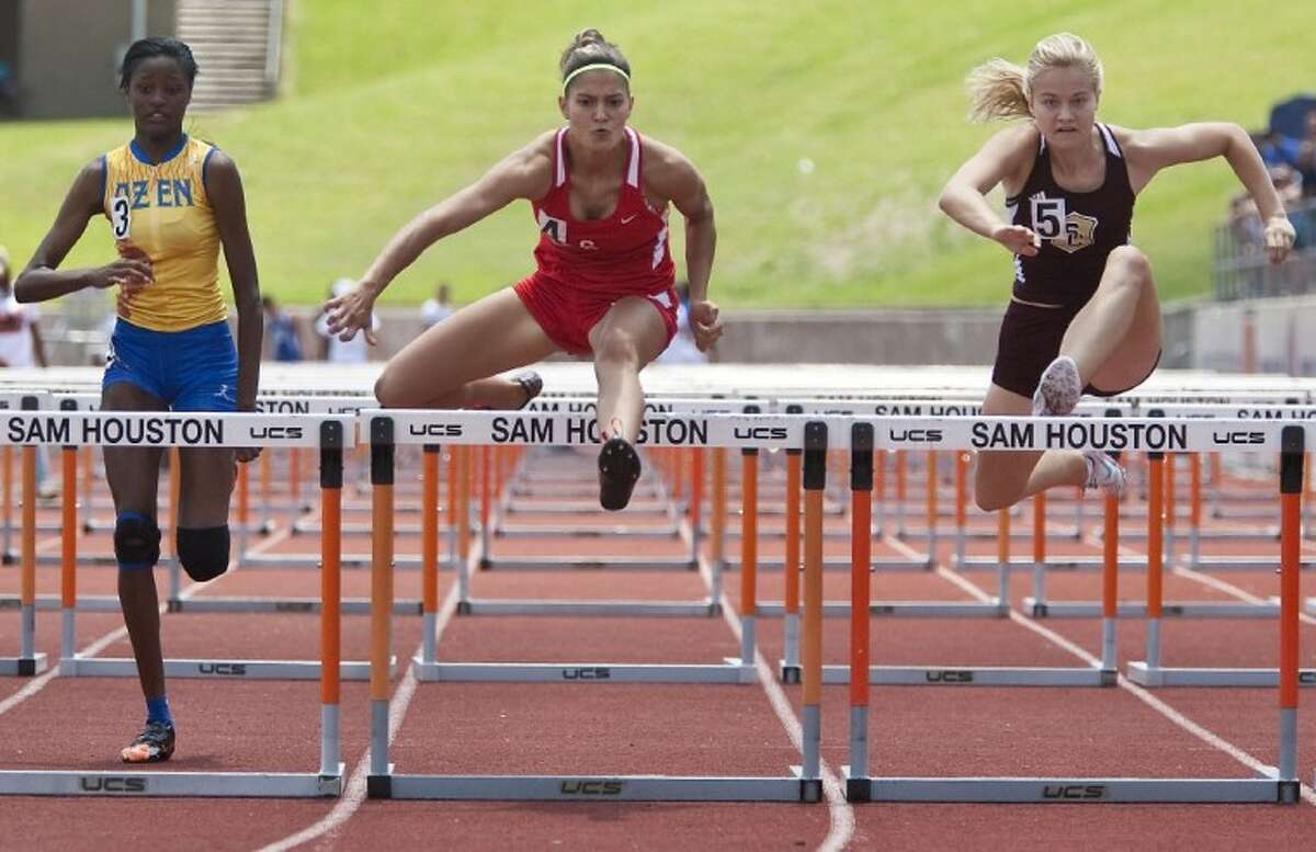 Caney Creek’s Denise Corioescu competes in the 100-Meter Hurdles during the Region III-4A Track and Field Championships at Bowers Stadium in Huntsville.