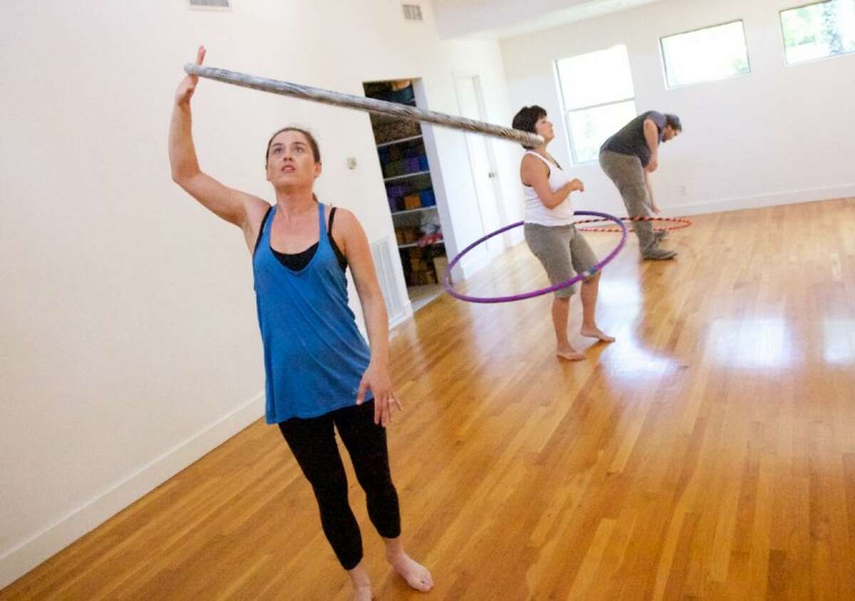 A class member tries a hoop technique during a Hoopnotica class.