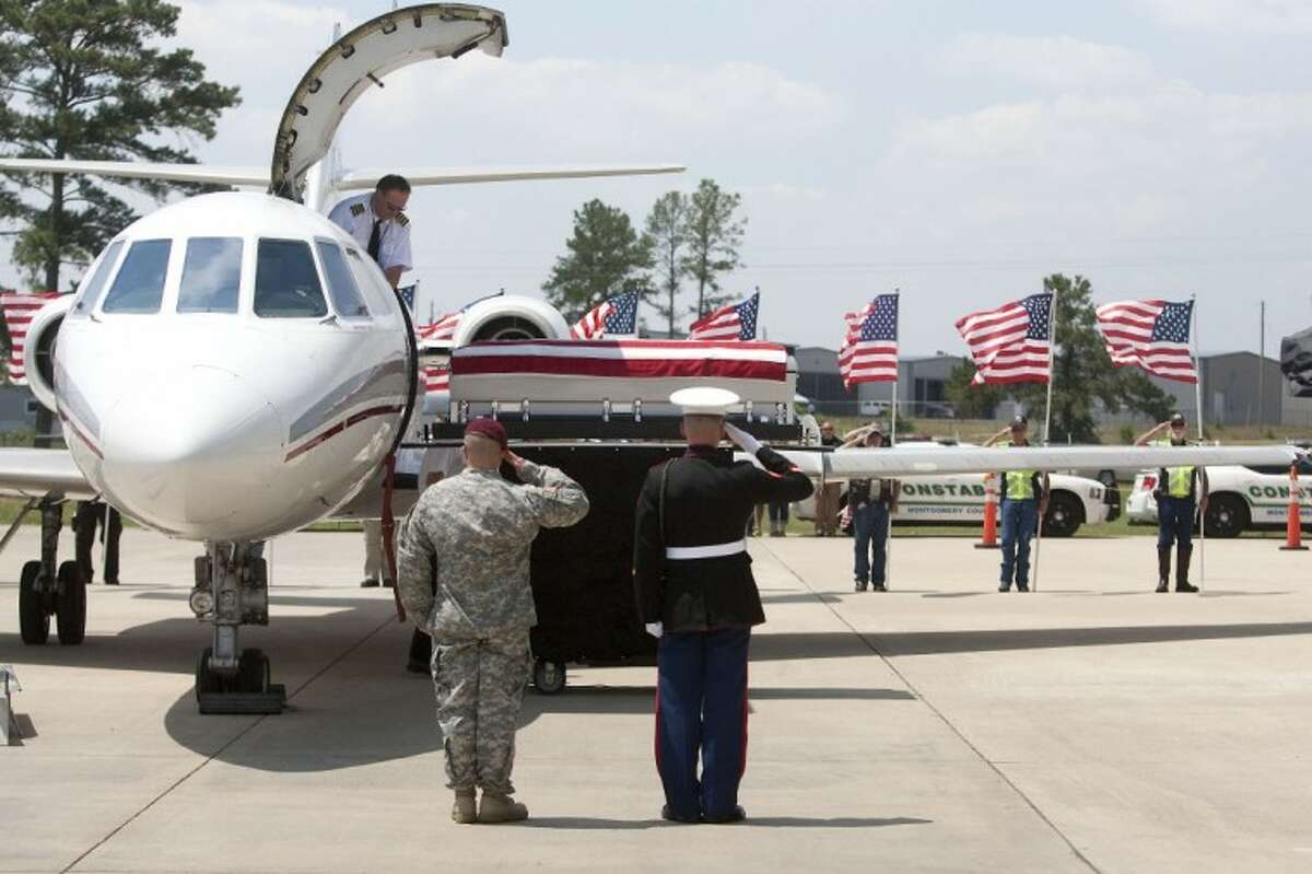 The body of Marine Sgt. Wade D. Wilson, 22, of Leon County, arrives Friday at the Lone Star Executive Airport in Conroe.