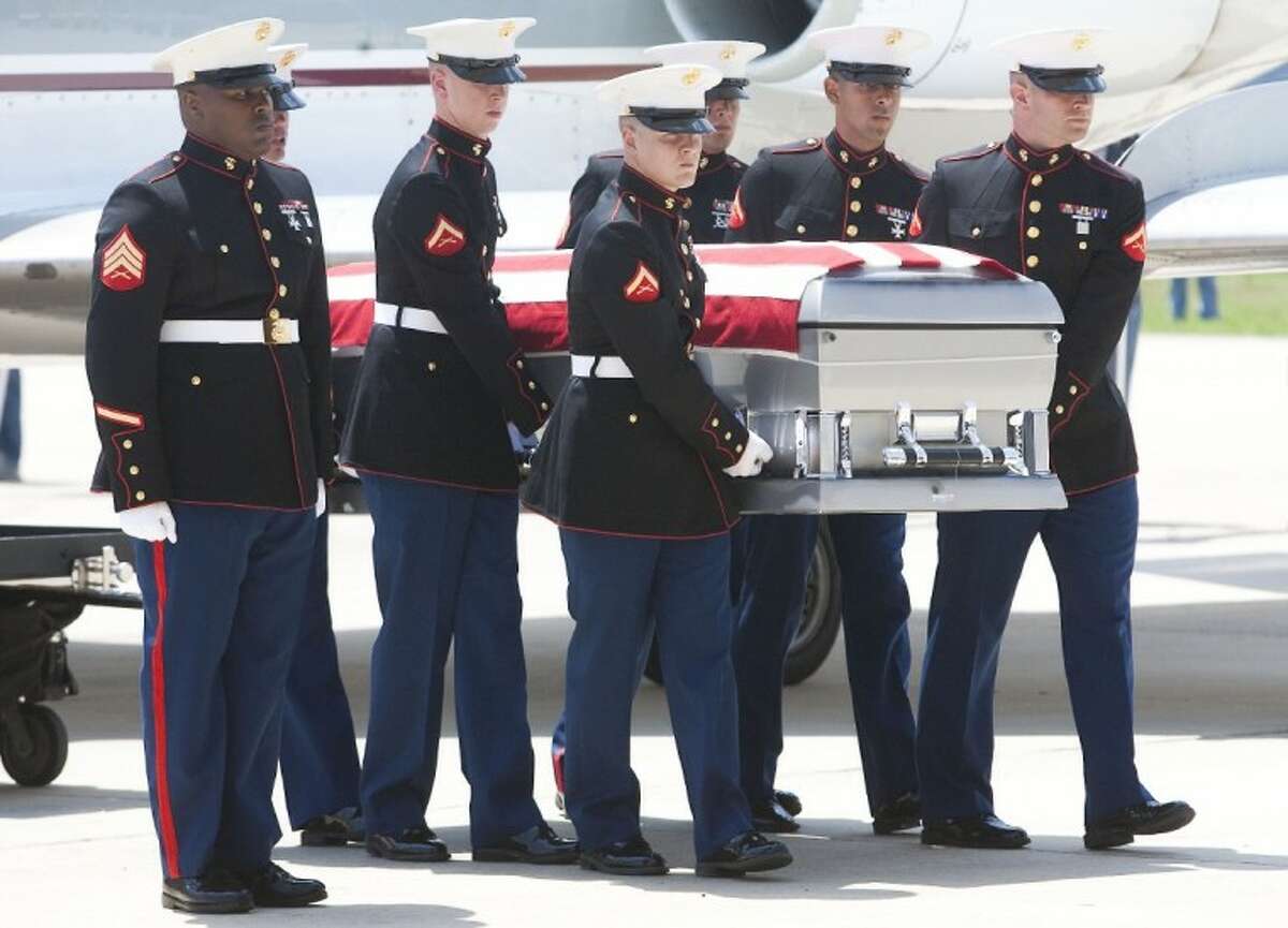 The body of Marine Sgt. Wade D. Wilson, 22, of Normangee, Texas, arrives Friday at the Lone Star Executive Airport in Conroe. Wilson died May 11 while conducting combat operations in Helmand province, Afghanistan.