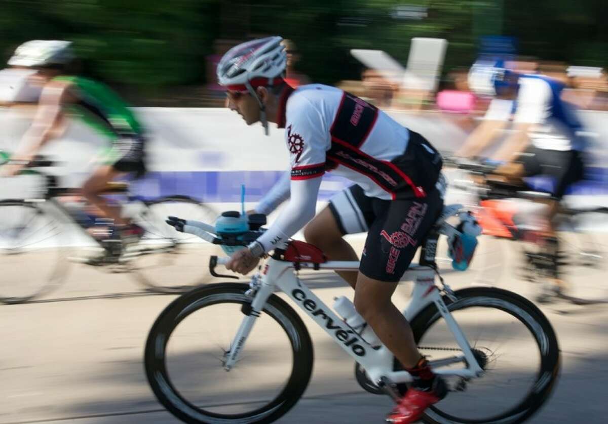 Triathletes embark on the start of the 112-mile bike ride during the Ironman Texas on May 19 in The Woodlands. More than 2,500 athletes participated in the event.