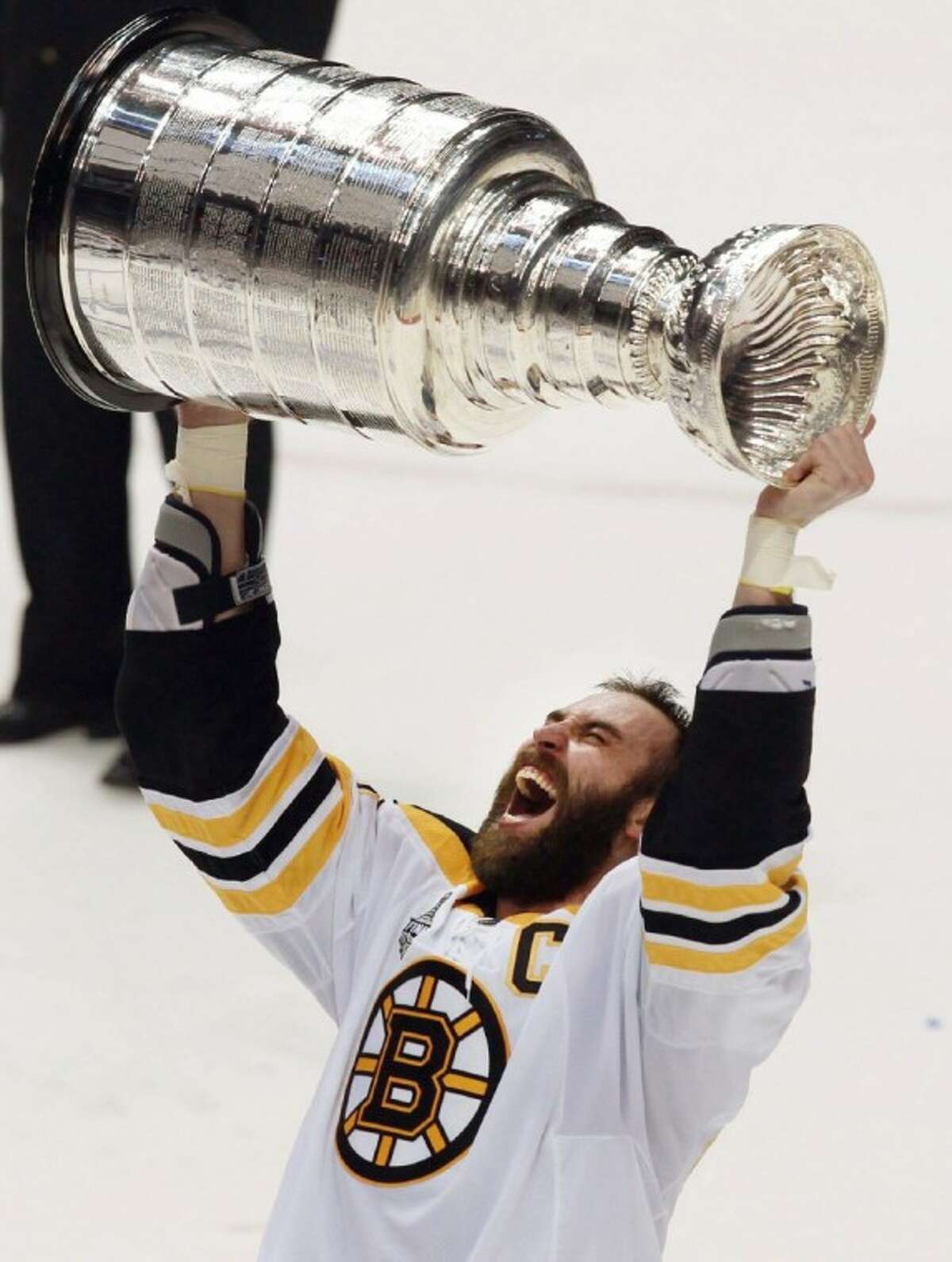 Boston Bruins captain, Zdeno Chara, hoists the Stanley Cup for the