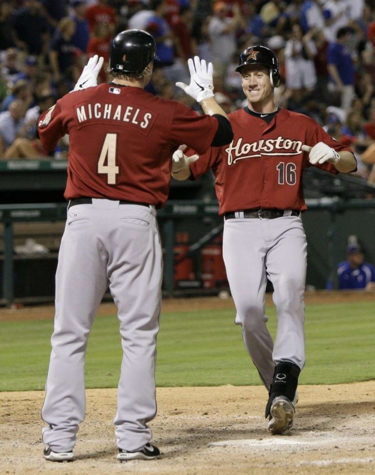 Houston Astros batter Carlos Coporan hits a two-RBI double during