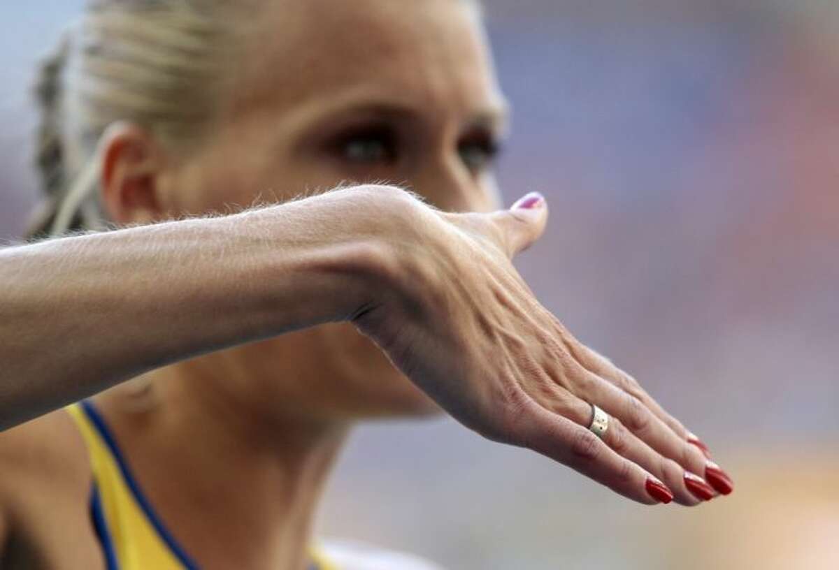Emma Green Tregaro prepares to competes in the women’s high jump final on Saturday at the World Championships in Moscow. The Swede, who sparked a controversy by painting her fingernails in the colors of the rainbow to support gay rights, took the field Saturday with bright red nails “for love,” she said. Tregaro had been told that the rainbow motif could be a violation of the championships’ code of conduct.