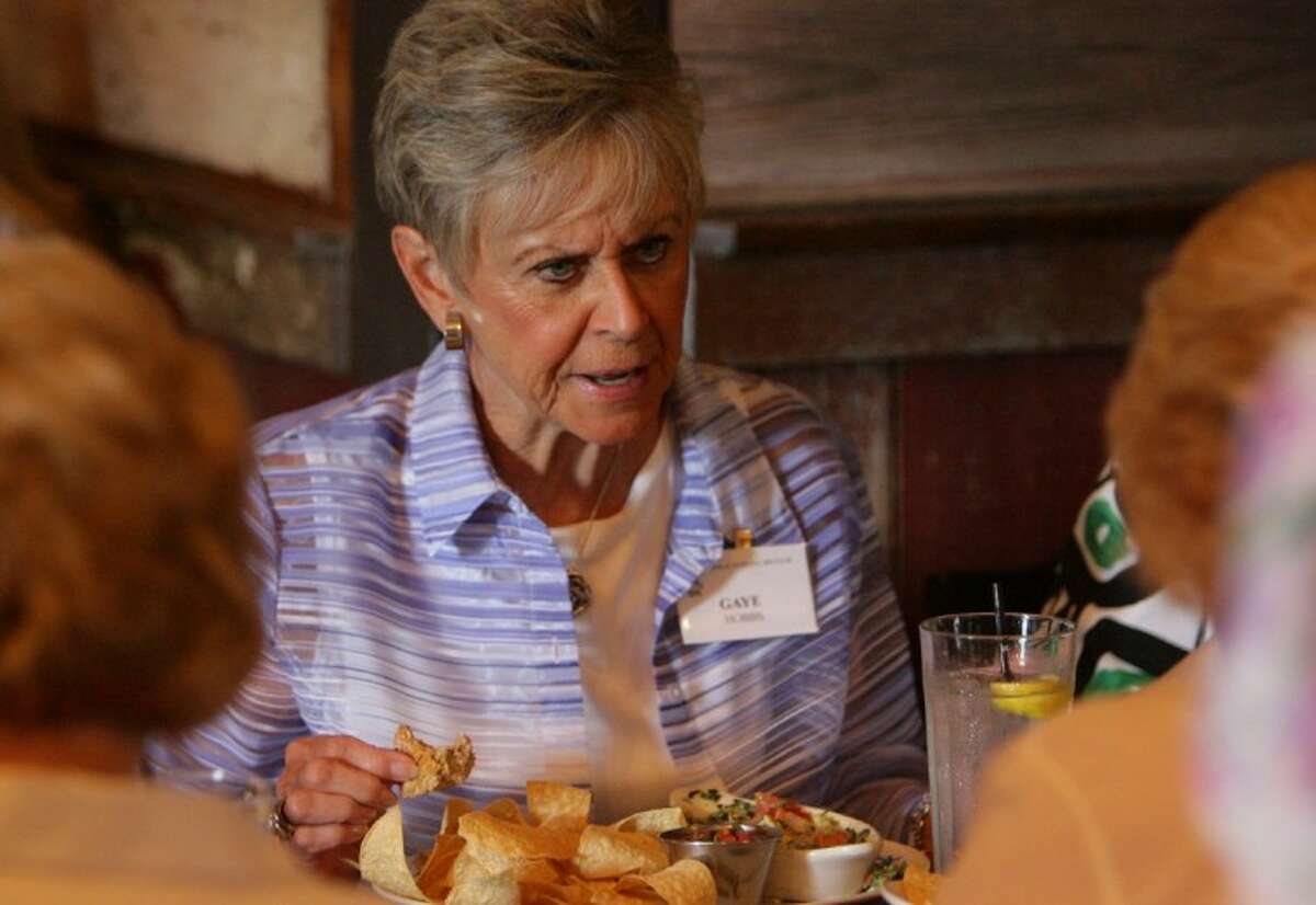 Gaye Hobbs enjoys lunch with fellow members of the Lake Conroe Area Newcombers Club Thursday.