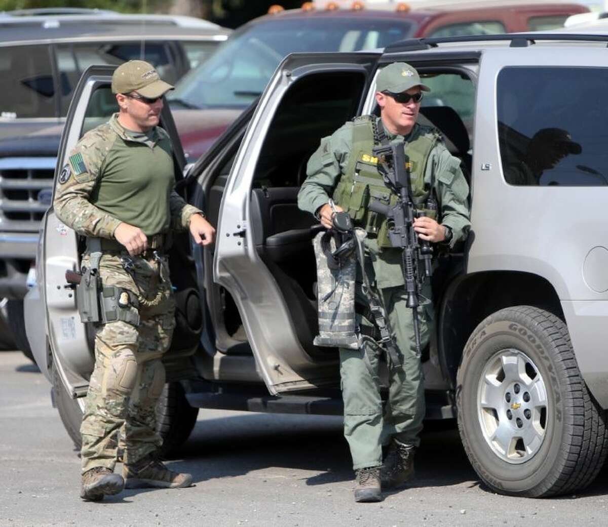 Law enforcement personnel head into the Valley County Emergency Operations Center during a search for James DiMaggio Saturday in Cascade, Idaho. About 150 federal agents converged on Idaho’s Frank Church River of No Return Wilderness in the search for 16-year-old Hannah Anderson and her suspected abductor. Anderson was found safe Saturday and her alleged abductor was killed.