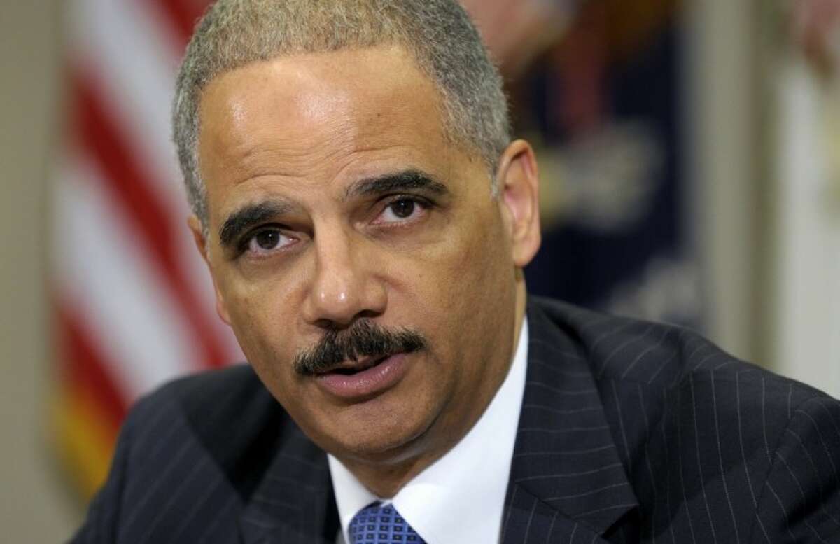 In this July 26 file photo, Attorney General Eric Holder speaks in the Cabinet Room of the White House in Washington. The Republican-run House has asked a federal court to enforce a subpoena against Attorney General Eric Holder. The subpoena demands that Holder produce records related to a bungled gun-tracking operation known as Operation Fast and Furious.