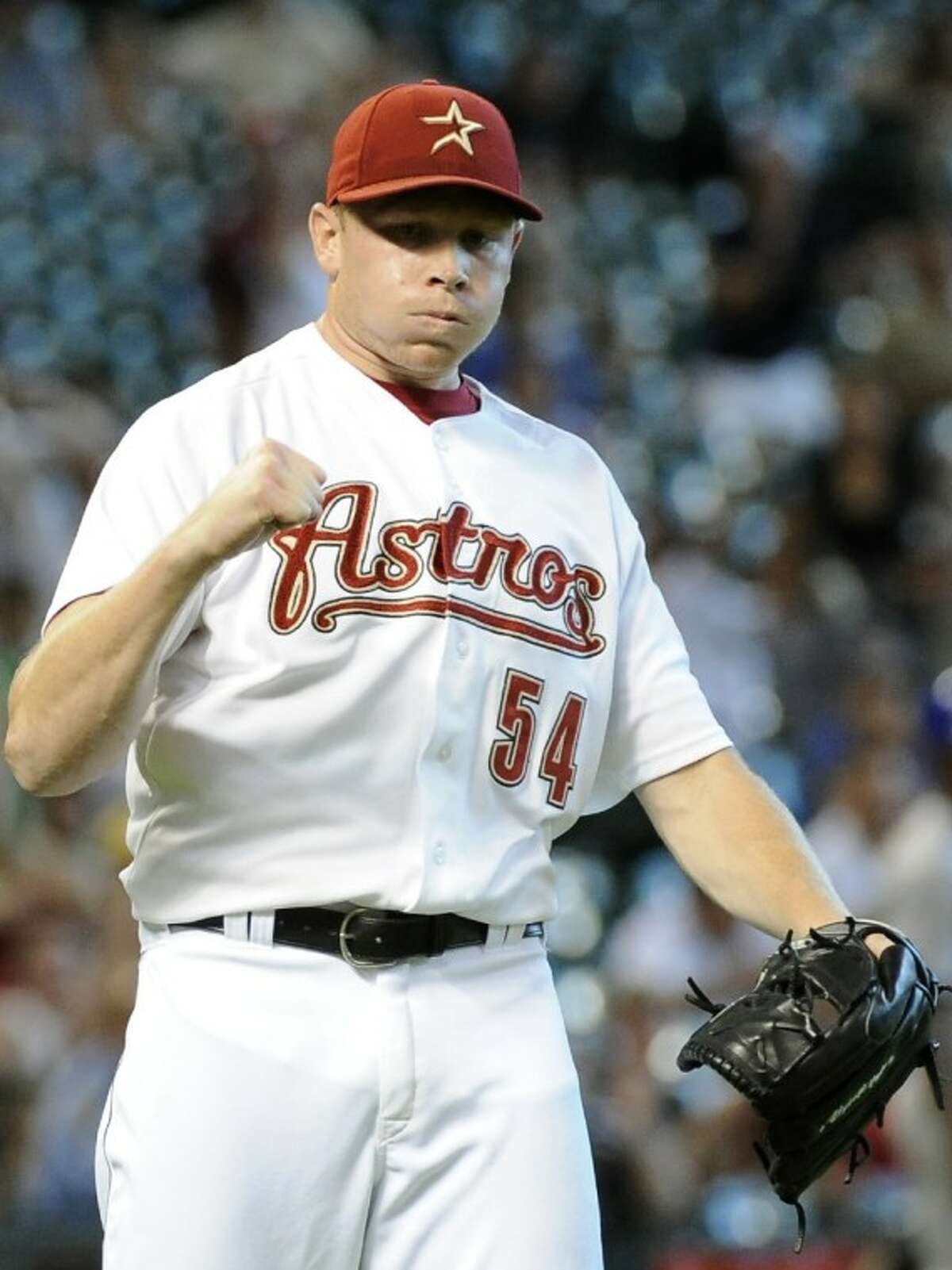 Houston Astros closer Mark Melancon reacts to the last out of the ninth inning as the Astros beat the Chicago Cubs 4-3 on Wednesday in Houston.