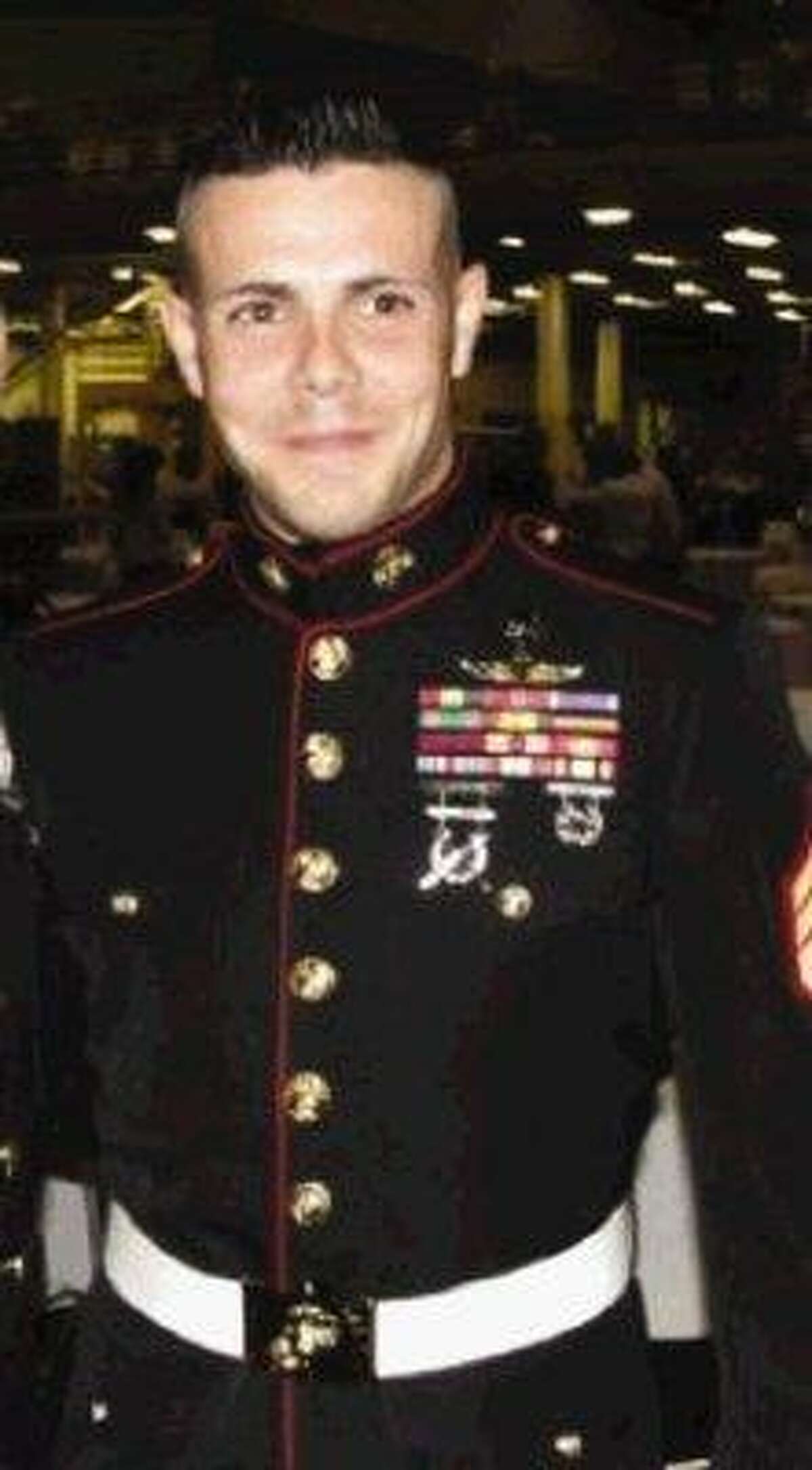 This undated photo shows Jesse Bernard Johnston III, 26, wearing a Marine dress uniform with ribbons and medals even though records show he never served in the Marine Corps.