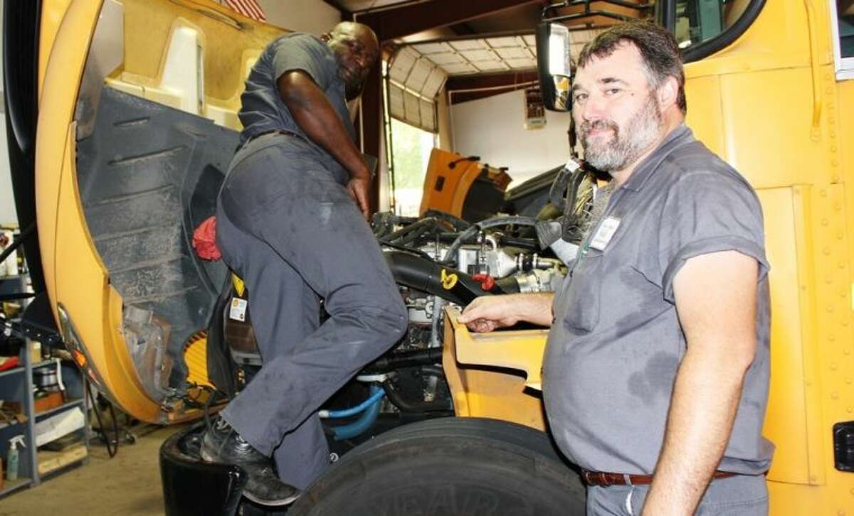 All of the WISD buses received a thorough inspection and safety-check over the summer break from Mechanic Charles Thomas, left, and Shop Foreman Alan Hammond.