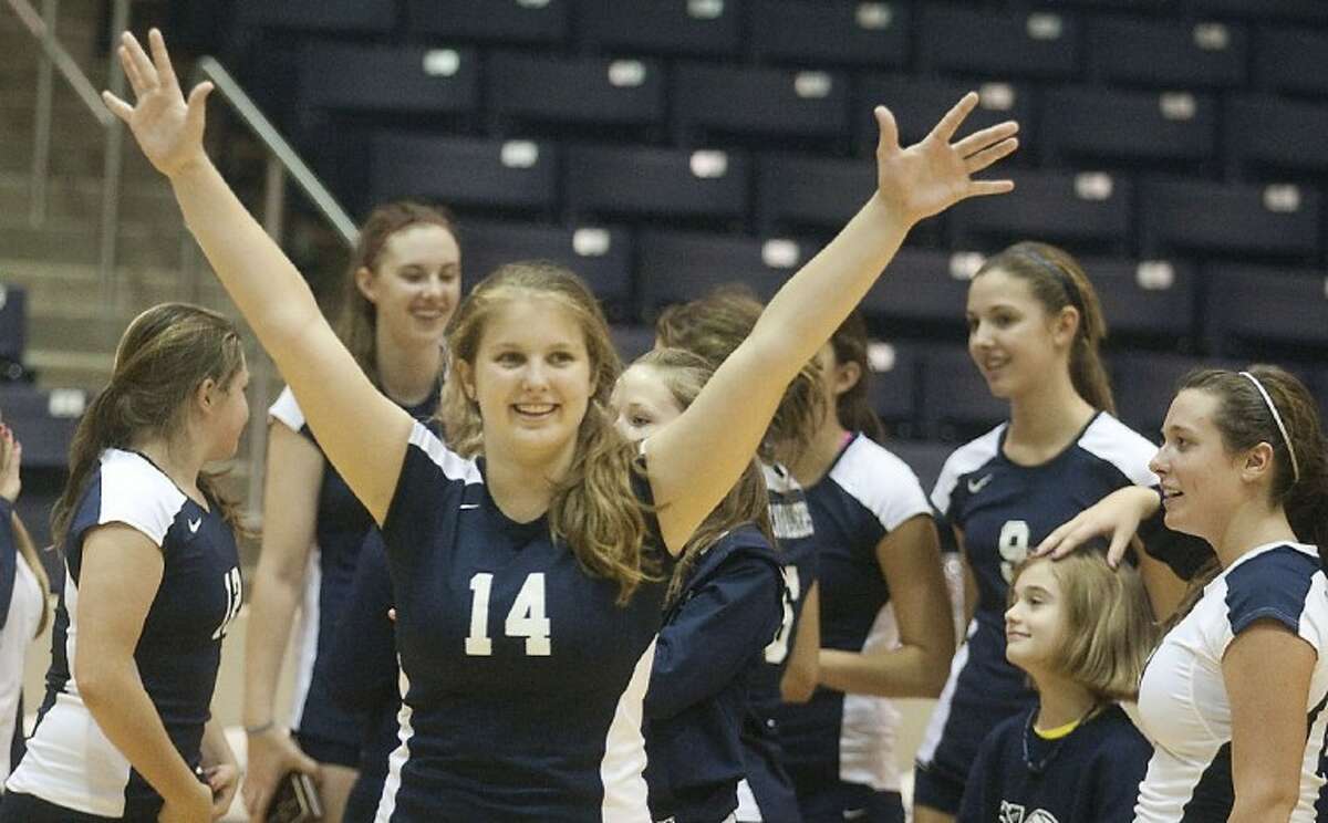 College Park’s Emily Lawlis celebrates after defeating Cy-Falls during the championship game of the Spring Branch Volleyball Classic tournament held at the Don Coleman Coliseum on Saturday afternoon.