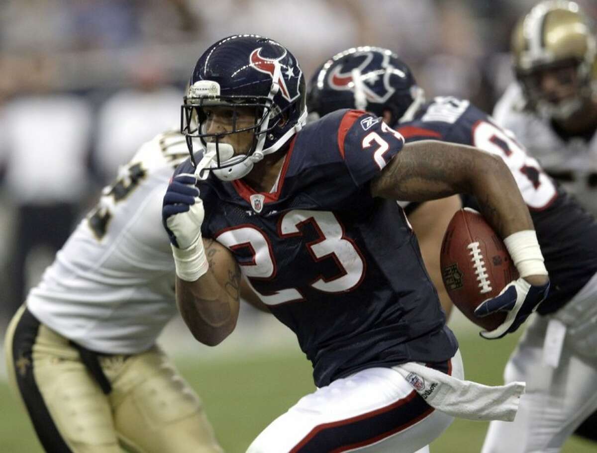 Houston Texans running back Arian Foster rushes for a touchdown in the first quarter against the New Orleans Saints on Saturday in Houston.