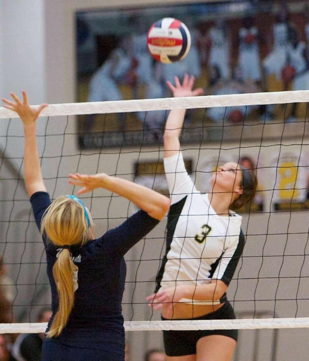 Conroe’s Alexis Nettles goes up for a spike during Friday night’s non-district match against Tomball Memorial.
