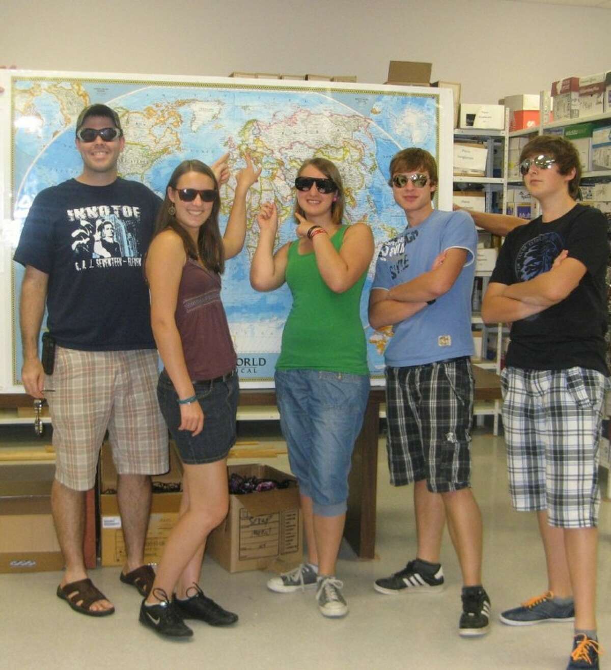 German exchange students with the First United Methodist Church of Conroe volunteered for a day at the Conroe Noon Lions Club Eyeglass Recycling Center. For their efforts, students got to choose a cool set of sunglasses. Pictured (left to right) are Youth Director Jonathan Davis, Franzi Skiewski, Michal Burkhardt, Rafael Burkhardt and Ruben Gunzenhauser.