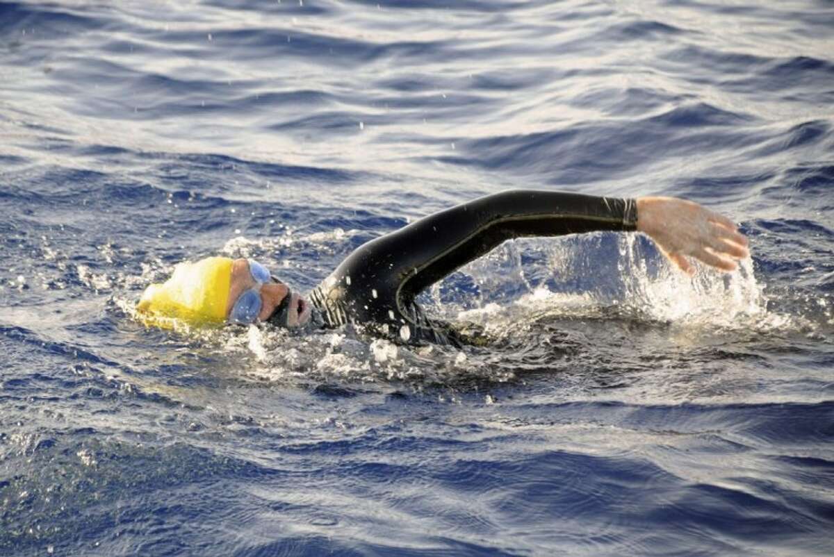 In this photo provided by Diana Nyad via the Florida Keys News Bureau, endurance swimmer Diana Nyad swims in the Florida Straits between Cuba and the Florida Keys Sunday.. Nyad is endeavoring to become the first swimmer to transit the Florida Straits from Cuba to the Keys without a shark cage.