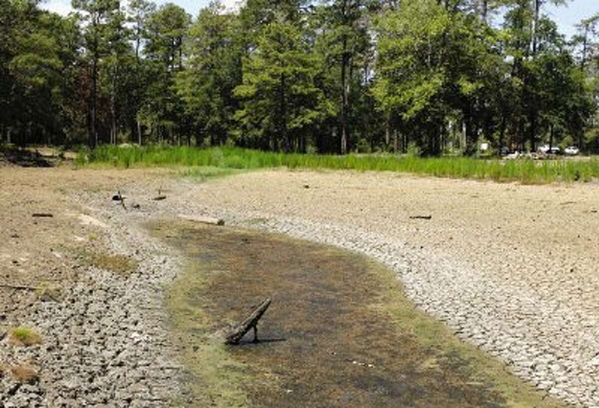 A pond at W.G. Jones State Forest on FM 1488 has suffered heavily due to the record drought. The Lone Star Groundwater Conservation District will have a public forum today to discuss the possibility of a new water source in the Catahoula Aquifer in light of the drought.