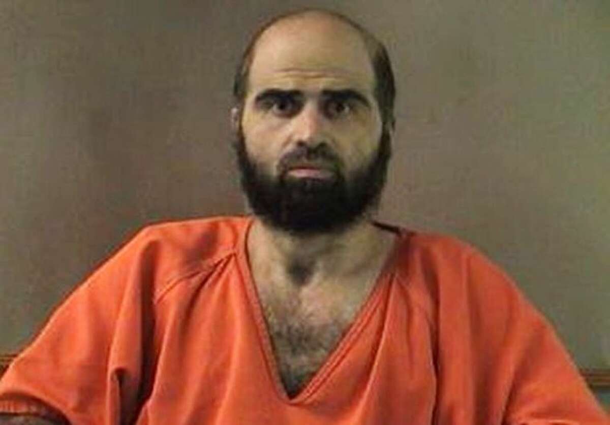 FILE - This undated file photo provided by the Bell County Sheriff's Department shows Maj. Nidal Hasan. Hasan has been convicted of murder for the 2009 shooting rampage at Fort Hood that killed 13 people and wounded more than 30 others. Hasan and many of his victims seem to want the same thing - his death. But while survivors and relatives of the dead view lethal injection as justice, the Army psychiatrist appears to see it as something else - martyrdom. (AP Photo/Bell County Sheriff's Department, File)