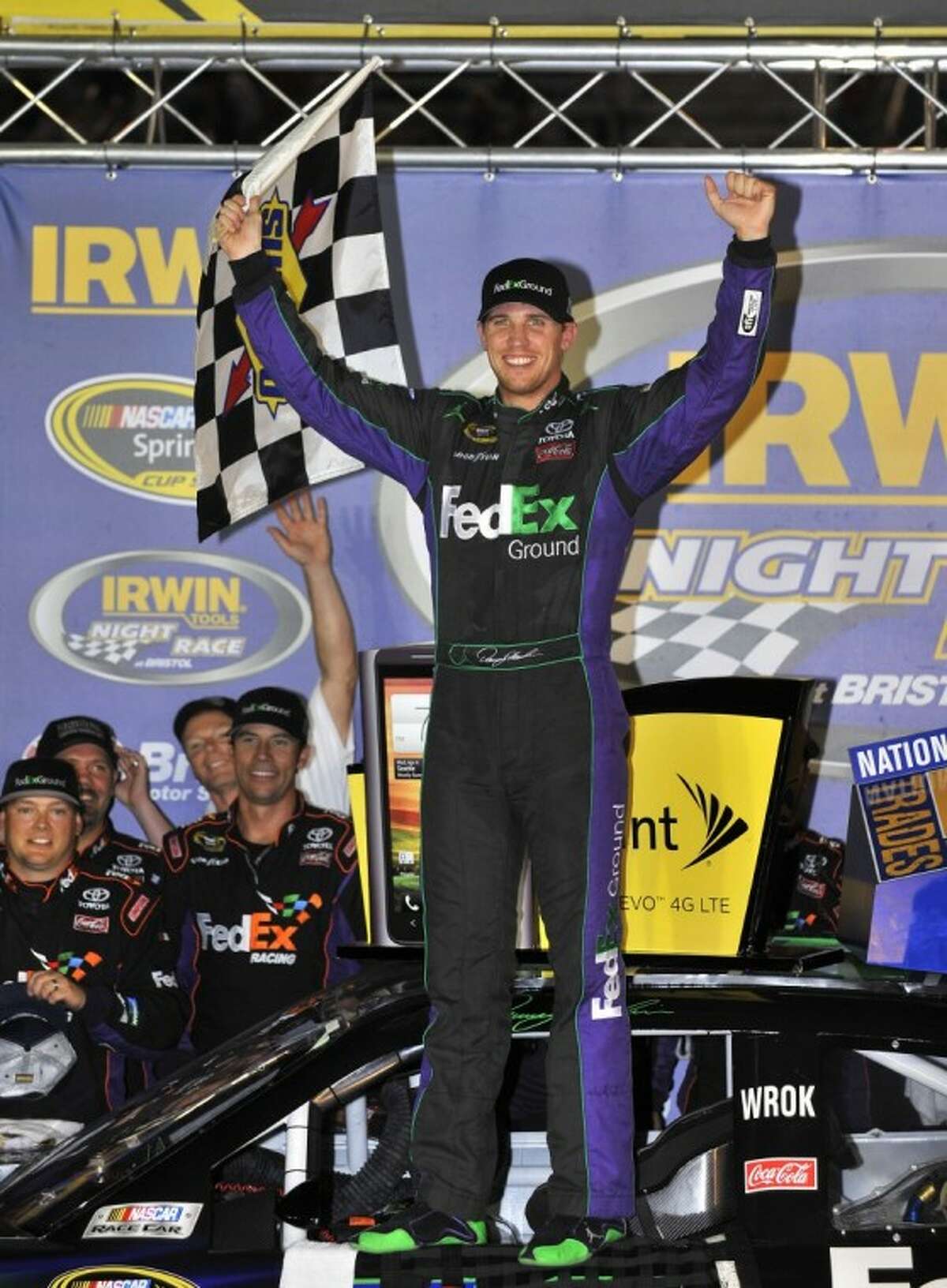 Denny Hamlin celebrates his win in the NASCAR Sprint Cup Series auto race at Bristol Motor Speedway.
