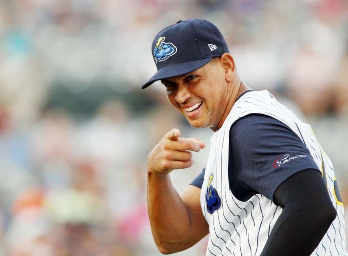 The New York Yankees’ Alex Rodriguez points toward a fan before playing for the Double-A Trenton Thunder against the Reading Phillies on Friday in Trenton, N.J.