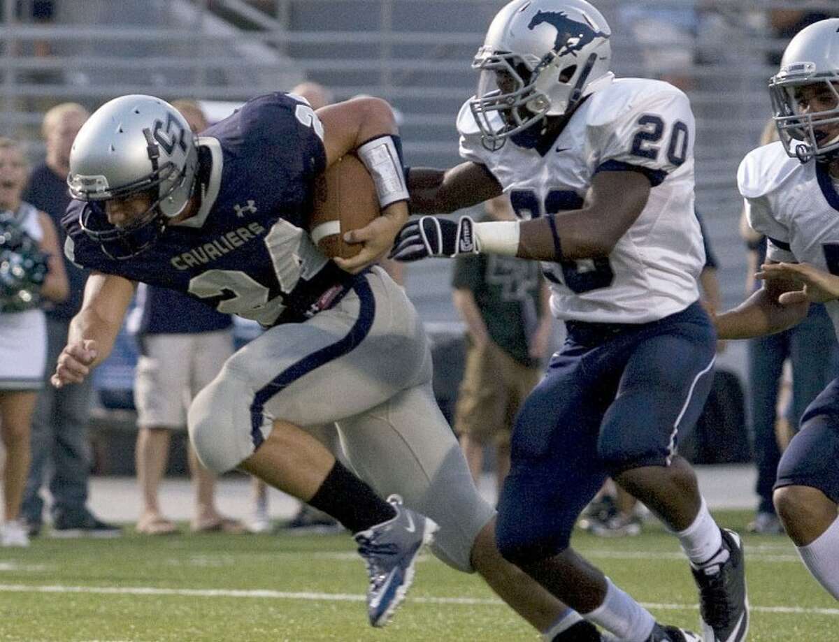 Shenandoah,TX - College Park Cavalier Varsity running back #24 Austin Boudreaux stumbles for a touchdown to put the Cavaliers up by 14 in the first quarter against Lamar Consolidated at Woodforest Bank Stadium.