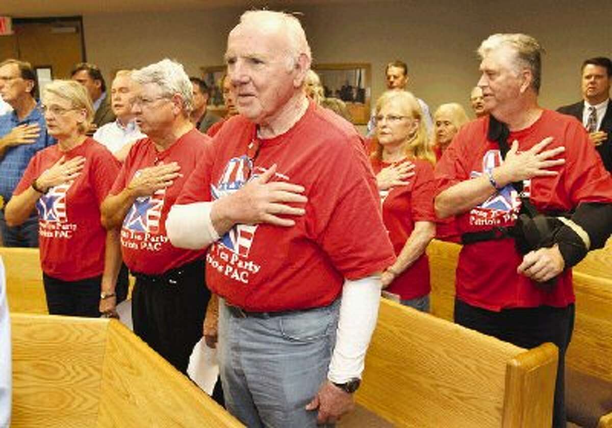 Numerous Texas Tea Party Patriots PAC members, many in their traditional red T-shirts, attended Montgomery County Commissioners Court Monday.