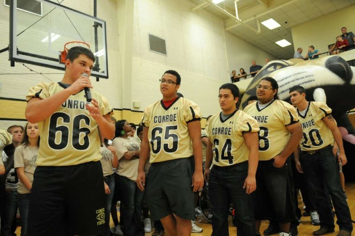 Conroe High School varsity football sophomore defensive lineman Quentin Frerichs (66) introduces himself during the 2012 "Meet the Tigers" event in the CHS gym on Monday. Photo by Jerry Baker