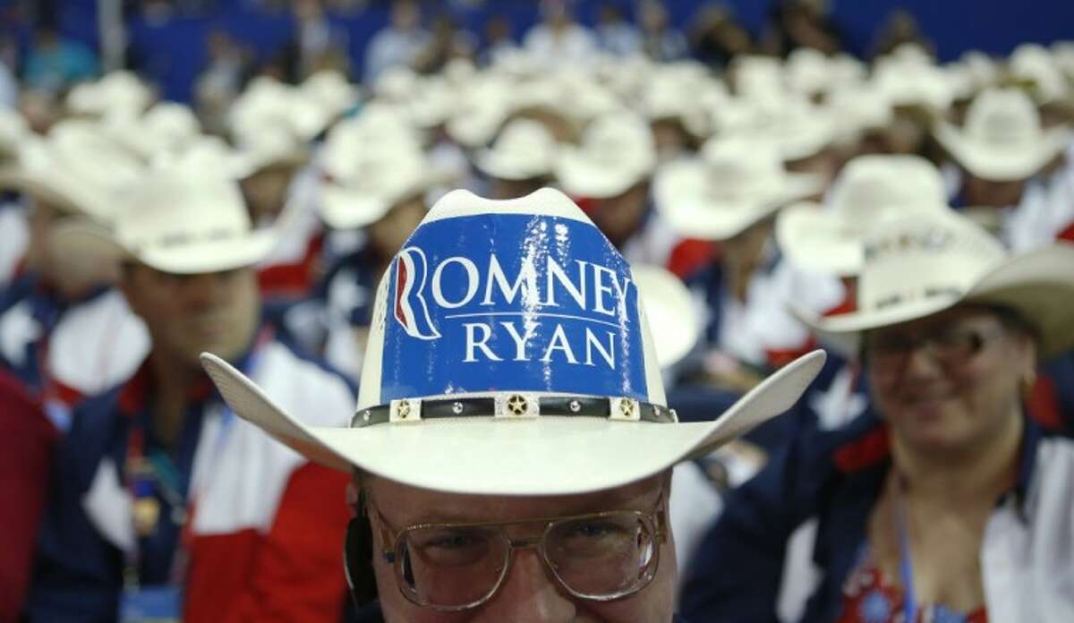 Texas delegate Clint Moore and the rest of Texas delegates fashion their cowboy hats at the Republican National Convention in Tampa, Fla., on Tuesday.