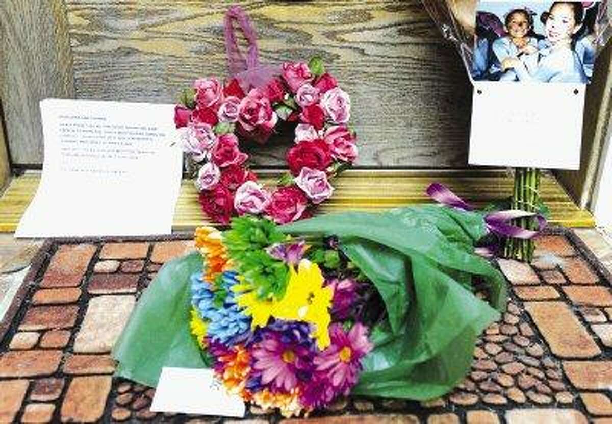 Letters and flowers lay on the front steps of Coppell Mayor Jayne Peters' home Wednesday in Coppell. The mayor of the upscale suburb of Dallas and her teenage daughter were found shot to death at their home, city officials said Wednesday. Police discovered the bodies of Peters, 55, and Corrine Peters, 19, Tuesday evening, city spokeswoman Sharon Logan said. Police found no signs of forced entry, Logan said.