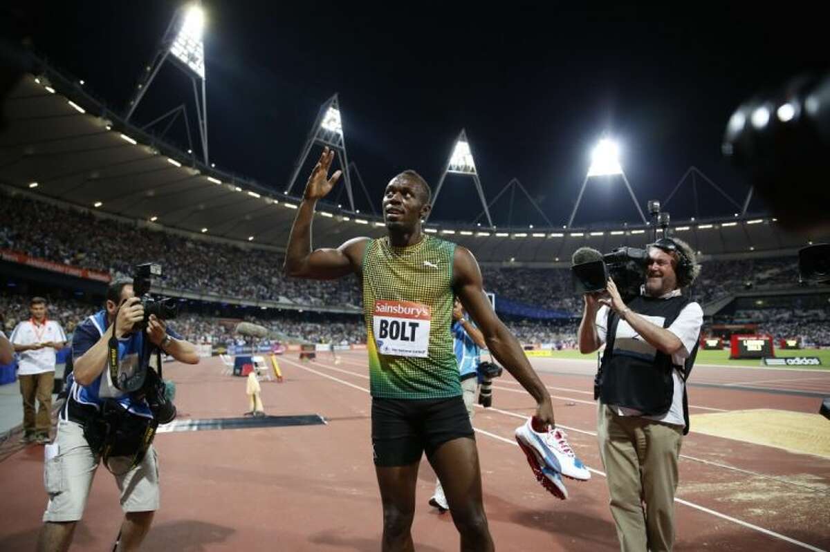 Jamaica’s Usain Bolt gestures to the crowd during a victory lap after winning the men’s 100-meter race during a Diamond League meet last month in London.
