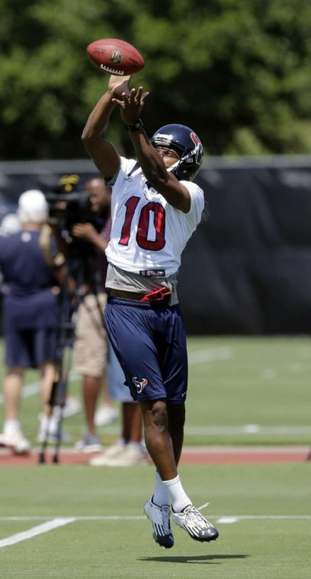 Houston Texans draft pick DeAndre Hopkins catches a pass during an organized team activities session on June 3 in Houston.