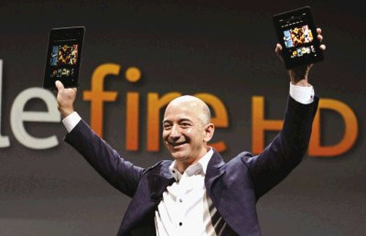 Jeff Bezos, CEO and founder of Amazon, holds the new Amazon Kindle Fire HD at the product’s introduction in Santa Monica, Calif.