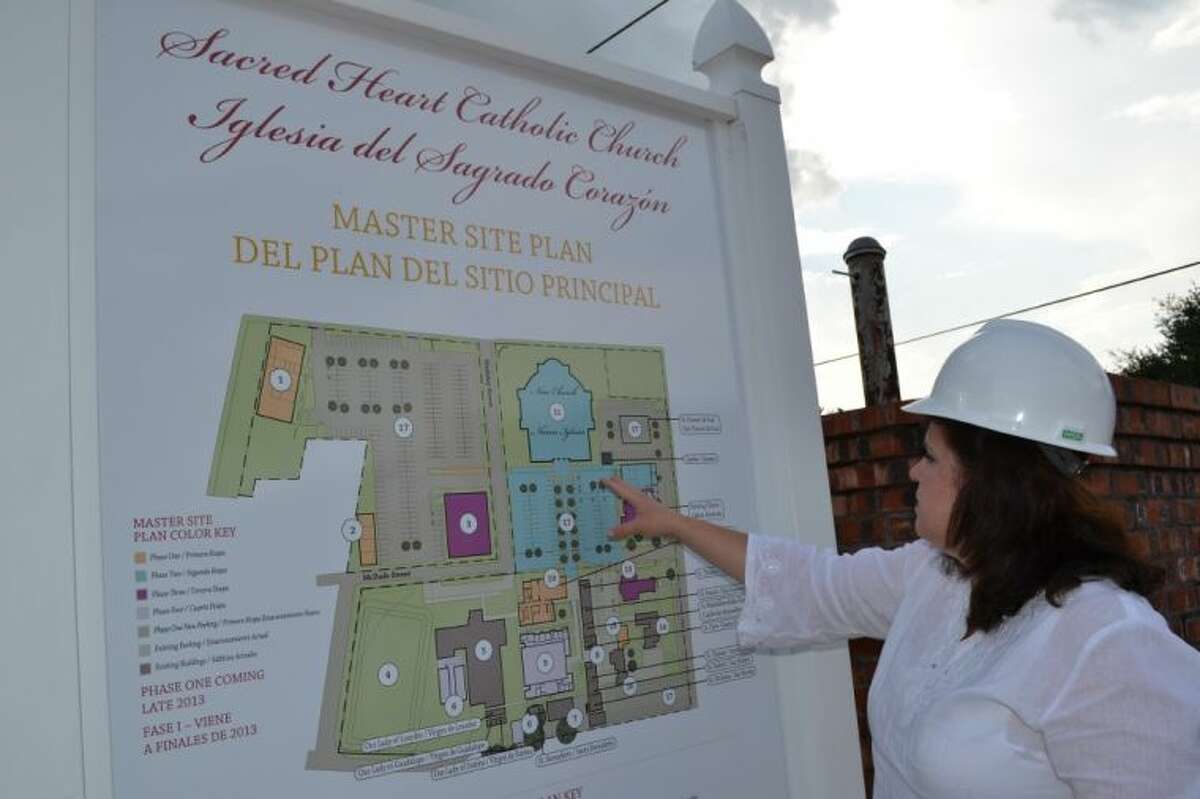 Sacred Heart Church Business Manager Eileen Borski points to the Master Site Plan of the current church and campus expansion during its three-year, $4.5 million capital campaign.