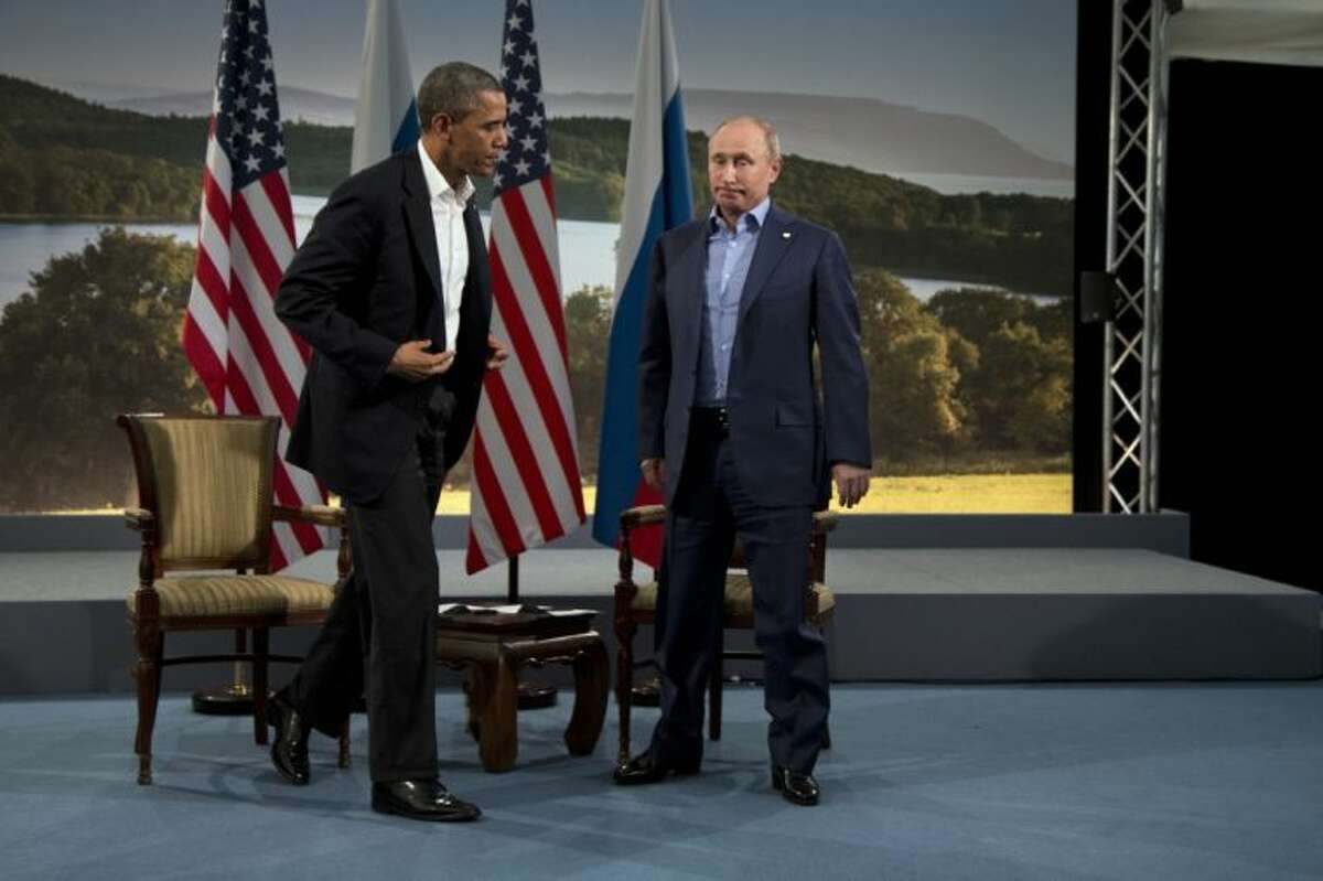 In this June 17 file photo, President Barack Obama and Russian President Vladimir Putin get up to leave after their meeting in Enniskillen, Northern Ireland. The Kremlin voiced disappointment Wednesday with Obama’s decision to cancel his Moscow summit with Putin, but said it remains ready to cooperate with the United States on bilateral and international issues.
