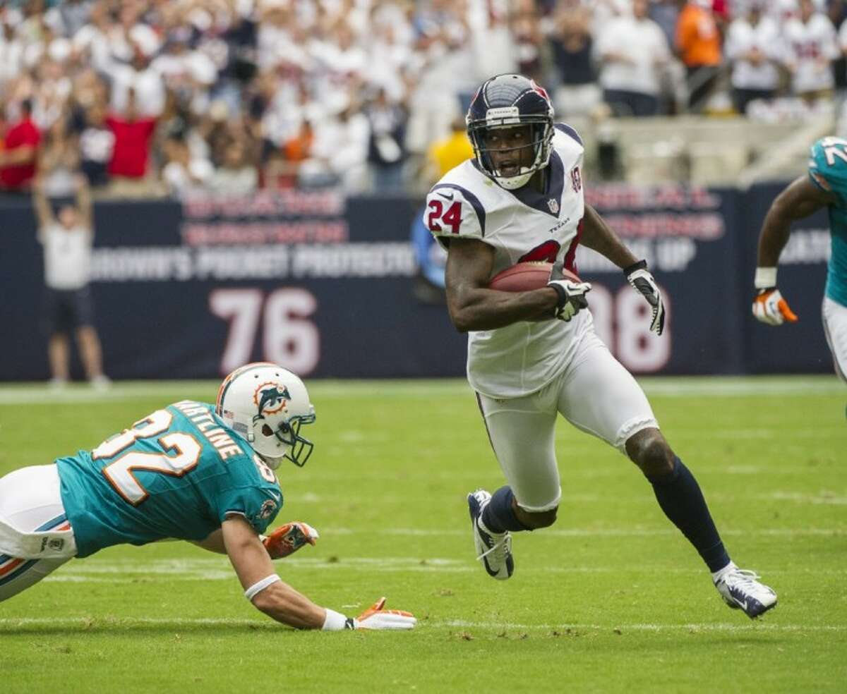 The Houston Texans’ Johnathan Joseph returns an interception against the Miami Dolphins. The Texans won 30-10.