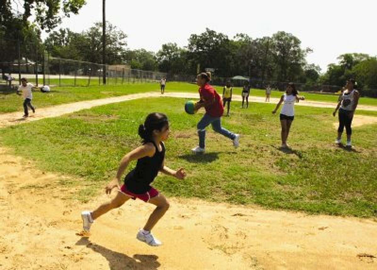 Staffers and students at the City of Conroe’s Fun Quest played kick ball during the summer. The Fun Quest campers and staff logged more than 37,000 miles of activity this summer.