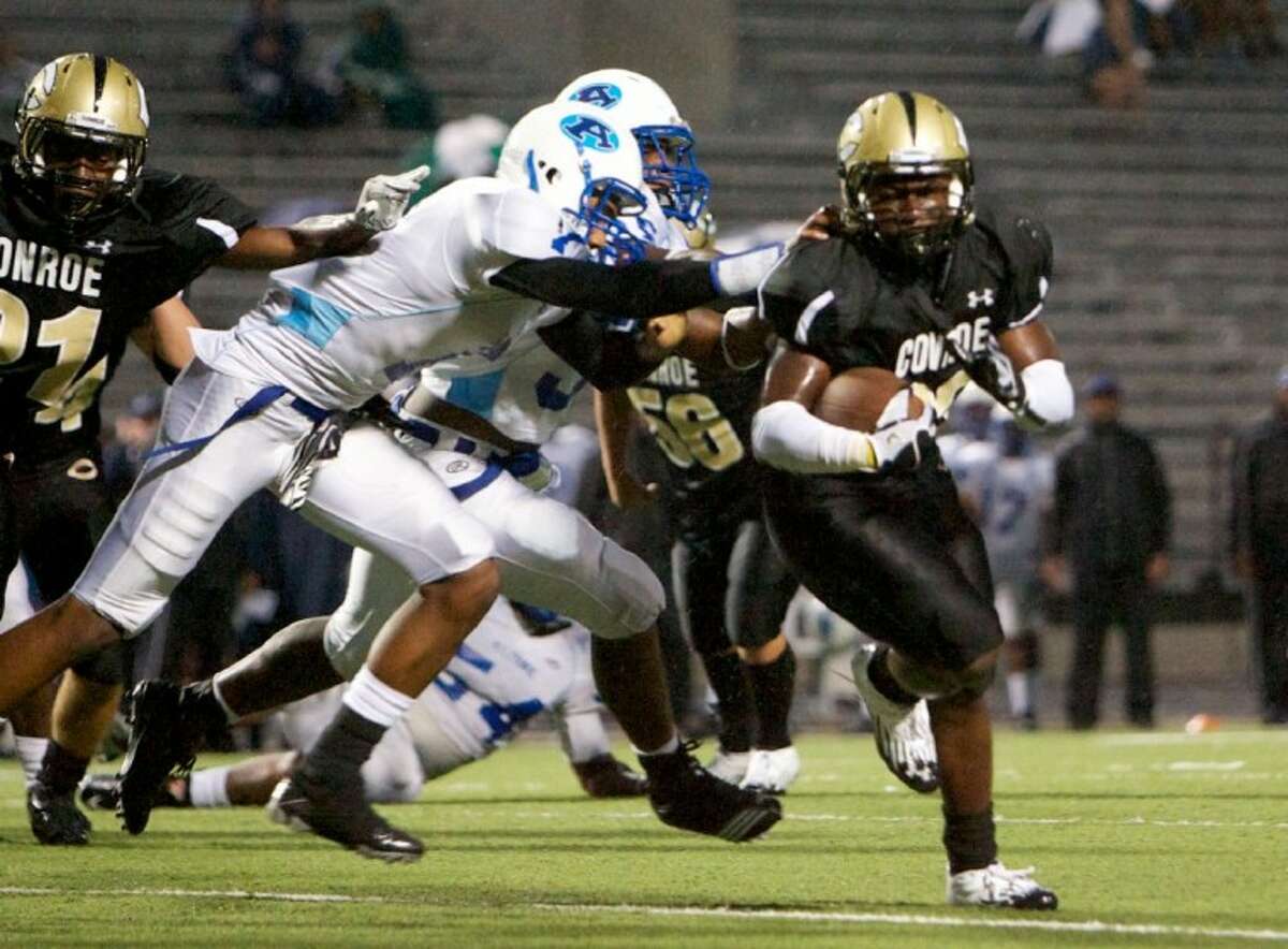 Conroe’s Larry Day runs for a 10-yard touchdown during Friday night’s game against Aldine at Buddy Moorhead Memorial Stadium. To purchase this photo and others like it, visit www.yourconroenews.com/photos.