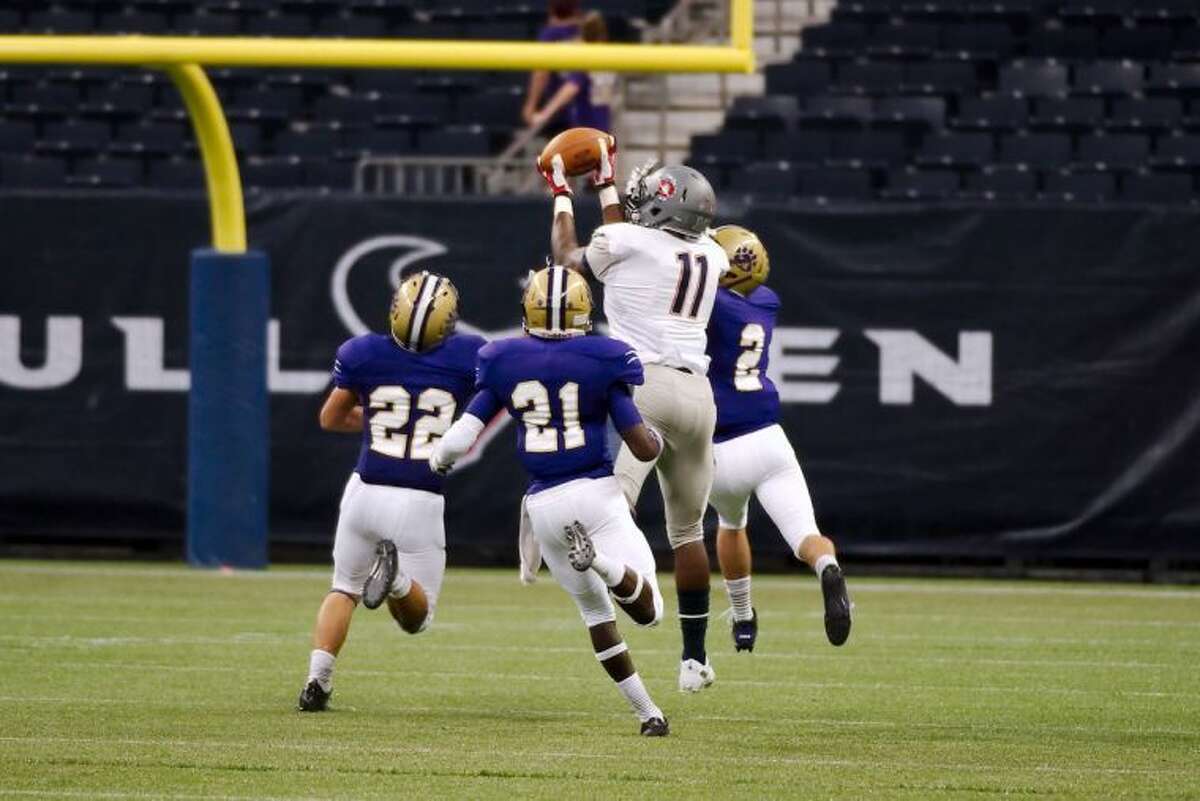 Dawson's Tony Upchurch makes the catch for a 40-yard gain against Montgomery on Thursday at Reliant Stadium.