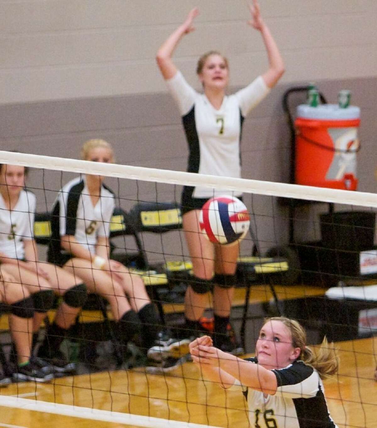 Conroe’s Emma Morrison digs the ball during Friday night’s game against College Park.