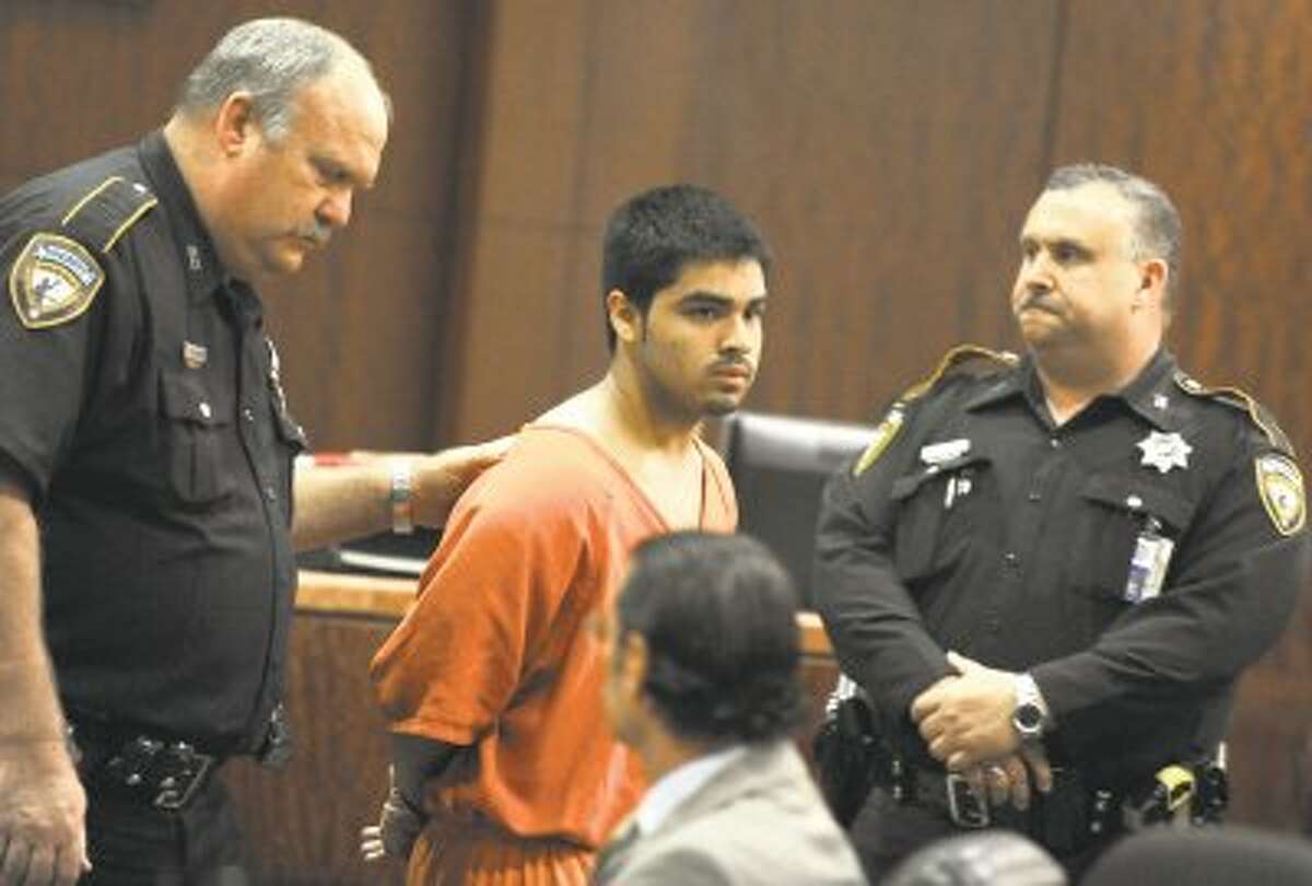 Luis Alonzo Alfaro is escorted from a courtroom by sheriffs deputies after a hearing Friday, in Houston. Alfaro, 17, has been charged with murder in Wednesday’s killing of 17-year-old Joshua Devon Broussard jailed on a $150,000 bond.