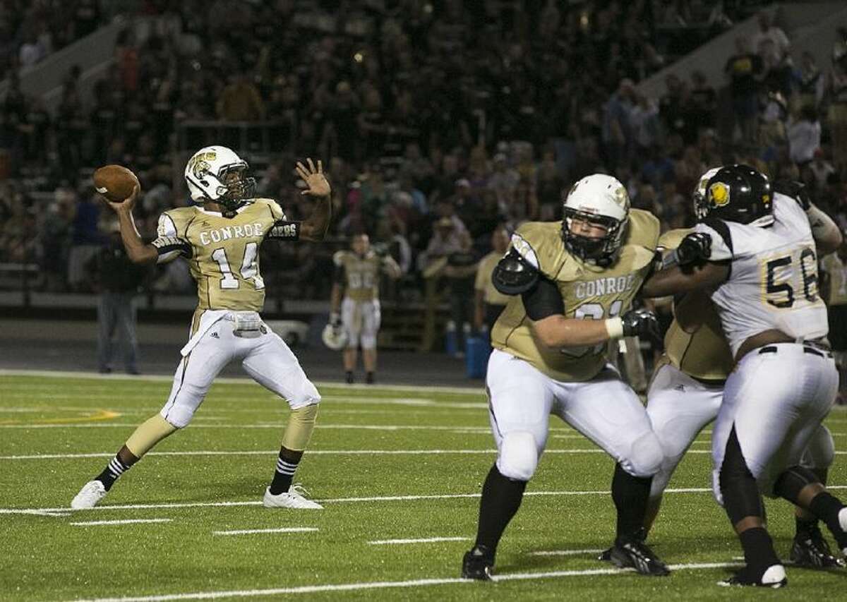 Conroe Tiger quarterback Stedman Bell prepares to unleash a touchdown strike to Zach Jones in second-quarter action against Aldine Hastings Friday night.